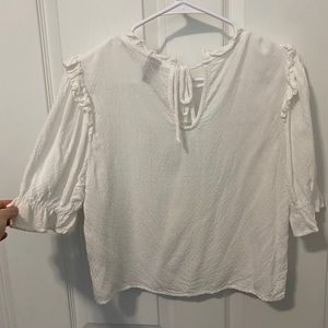 White blouse with neck and sleeve detail